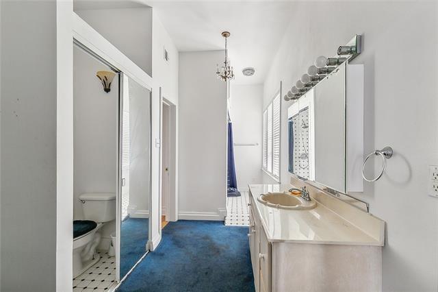 30 Clinton Dr, New Orleans, LA 70129 - bathroom featuring vanity and toilet