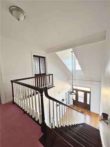 30 Clinton Dr, New Orleans, LA 70129 - stairway featuring baseboards