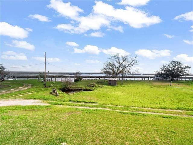 30 Clinton Dr, New Orleans, LA 70129 - view of home's community featuring a lawn