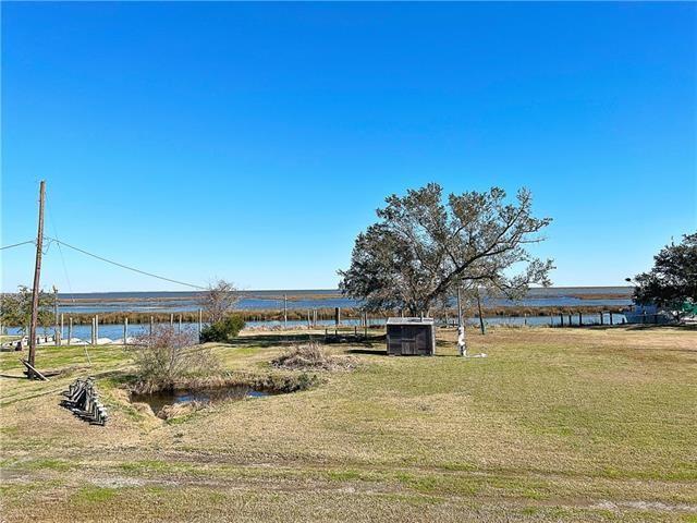 30 Clinton Dr, New Orleans, LA 70129 - view of green lawn featuring a water view