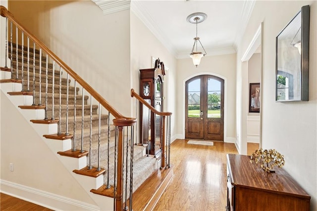 356 Aspen Ln, Covington, LA 70433 - entryway with light wood-type flooring, crown molding, arched walkways, and stairway