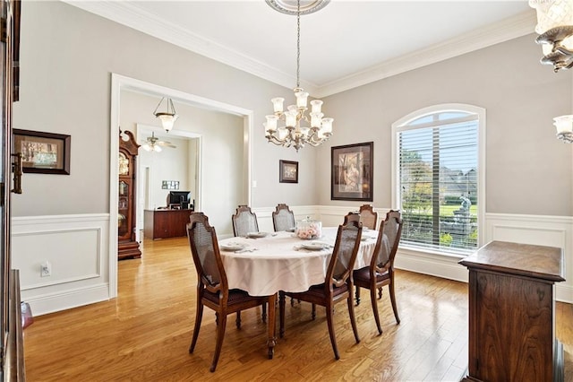 356 Aspen Ln, Covington, LA 70433 - dining area featuring a chandelier, plenty of natural light, crown molding, light wood finished floors, and wainscoting