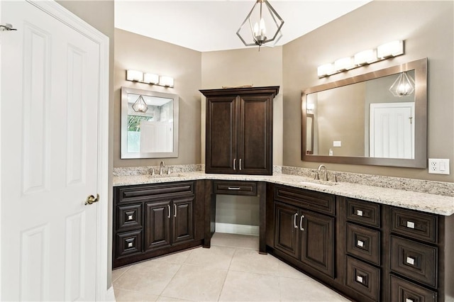 356 Aspen Ln, Covington, LA 70433 - bathroom with double vanity, tile patterned flooring, and a chandelier