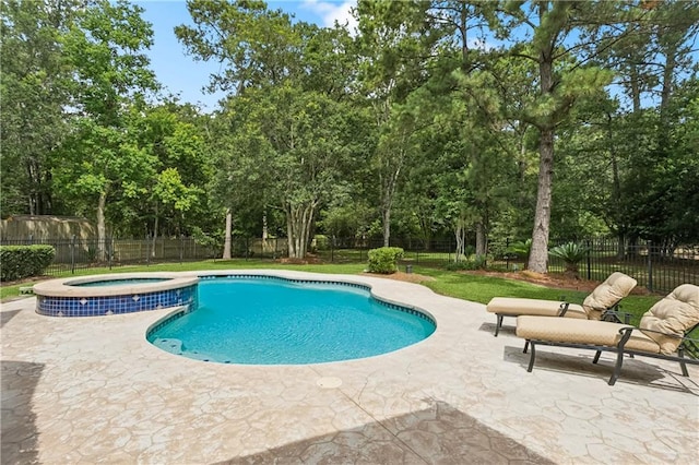 356 Aspen Ln, Covington, LA 70433 - view of pool featuring a patio area, a fenced backyard, view of scattered trees, and a pool with connected hot tub