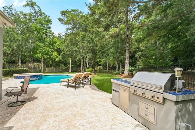 356 Aspen Ln, Covington, LA 70433 - view of swimming pool featuring a fenced backyard, a patio, exterior kitchen, and view of wooded area
