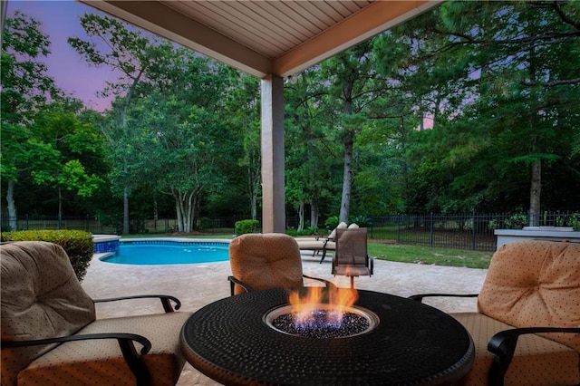 356 Aspen Ln, Covington, LA 70433 - view of swimming pool featuring a fire pit, a fenced backyard, a patio, and view of scattered trees