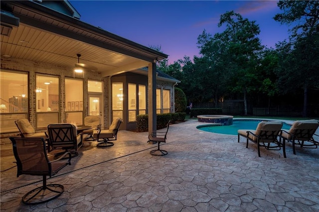 356 Aspen Ln, Covington, LA 70433 - pool at dusk featuring a patio area and a pool with connected hot tub