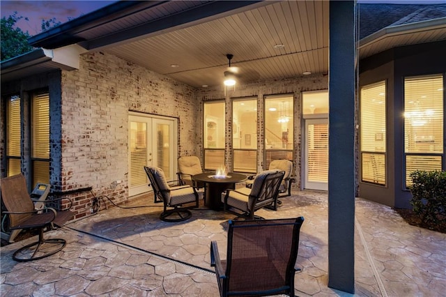 356 Aspen Ln, Covington, LA 70433 - patio terrace at dusk with a patio and a fire pit