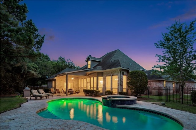356 Aspen Ln, Covington, LA 70433 - back of house featuring a patio area, a pool with connected hot tub, and brick siding