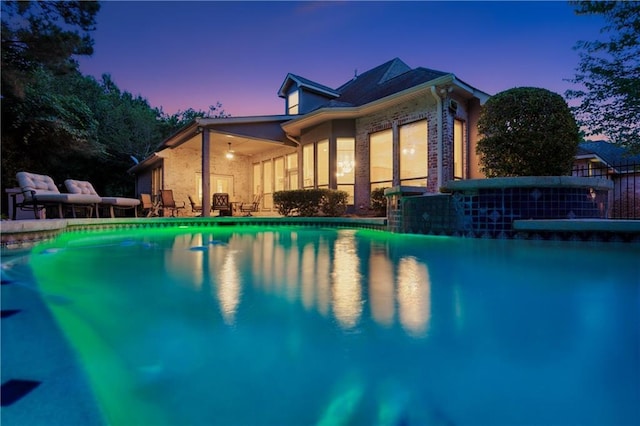 356 Aspen Ln, Covington, LA 70433 - pool at dusk featuring an outdoor pool