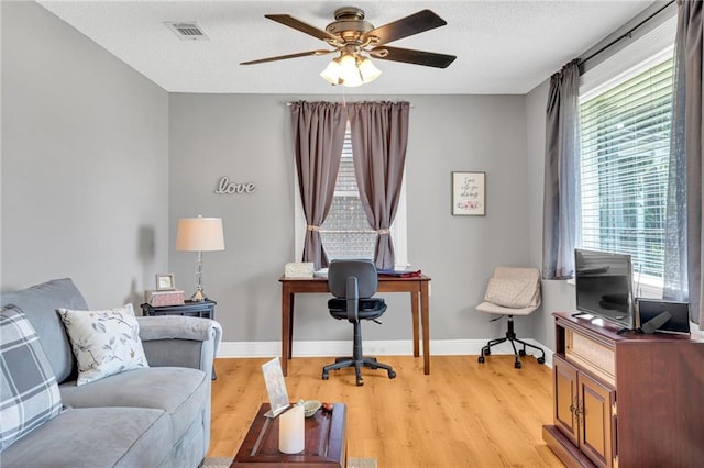 301 Rural St, River Ridge, LA 70123 - office space featuring light wood-type flooring, a ceiling fan, and a textured ceiling