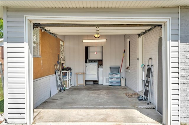 301 Rural St, River Ridge, LA 70123 - garage featuring washing machine and clothes dryer and concrete driveway