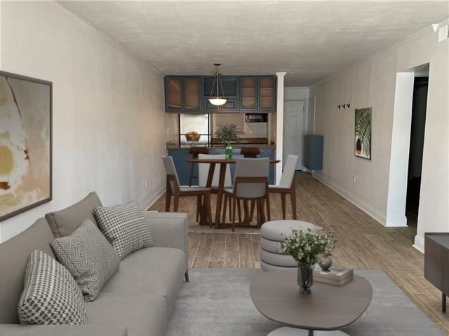 3805 Houma Blvd Unit B304, Metairie, LA 70006 - living room featuring wood finished floors and a textured ceiling