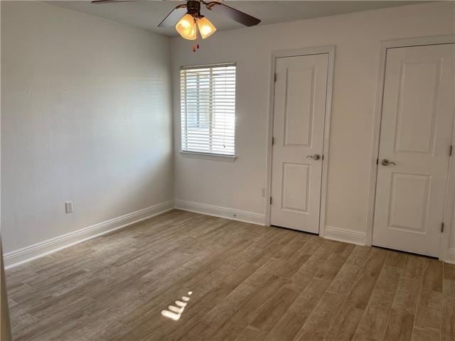 3805 Houma Blvd Unit B304, Metairie, LA 70006 - unfurnished bedroom with wood finished floors and ceiling fan