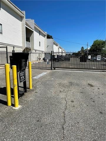 3805 Houma Blvd Unit B304, Metairie, LA 70006 - view of road with a gate and a gated entry