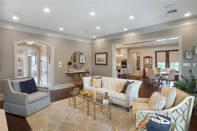 21 Royal Palm Dr, Kenner, LA 70065 - living room with wood finished floors, arched walkways, crown molding, recessed lighting, and a chandelier
