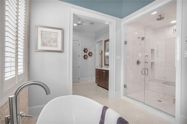 21 Royal Palm Dr, Kenner, LA 70065 - full bath with plenty of natural light, a shower stall, a freestanding bath, crown molding, and vanity