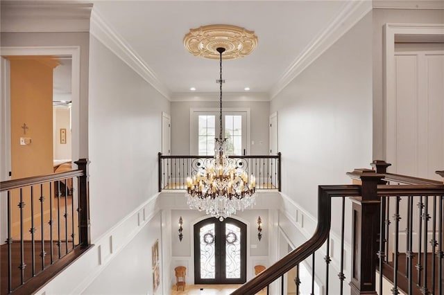 21 Royal Palm Dr, Kenner, LA 70065 - hall with a chandelier, an upstairs landing, french doors, ornamental molding, and recessed lighting