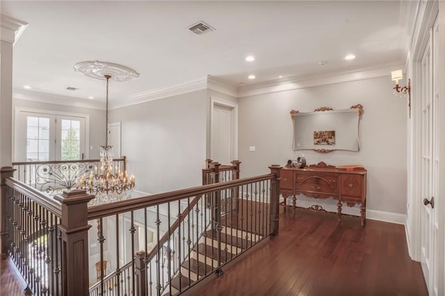 21 Royal Palm Dr, Kenner, LA 70065 - hall featuring an upstairs landing, wood-type flooring, a chandelier, ornamental molding, and recessed lighting