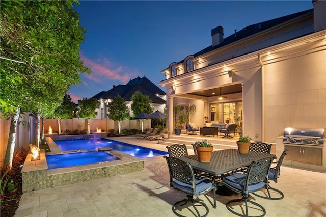 21 Royal Palm Dr, Kenner, LA 70065 - view of pool featuring an in-ground hot tub, a patio, outdoor lounge area, a grill, and a fenced backyard