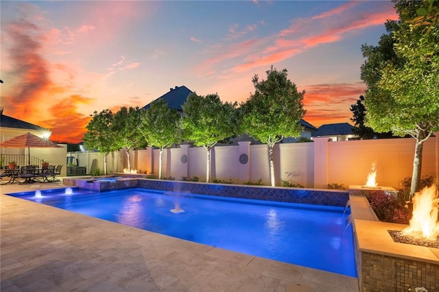 21 Royal Palm Dr, Kenner, LA 70065 - view of pool featuring an outdoor fire pit, a fenced backyard, a patio area, and a pool with connected hot tub