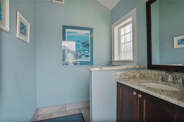 21 Royal Palm Dr, Kenner, LA 70065 - bathroom featuring vanity and lofted ceiling