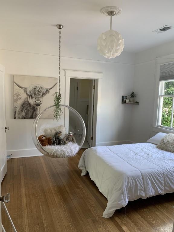 2527 Calhoun St, New Orleans, LA 70118 - bedroom featuring wood finished floors and baseboards