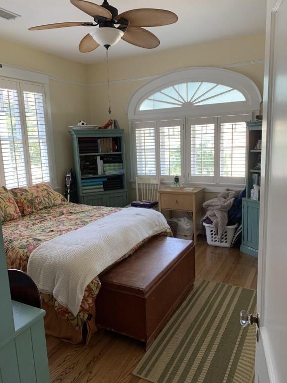 2527 Calhoun St, New Orleans, LA 70118 - bedroom featuring wood finished floors and a ceiling fan