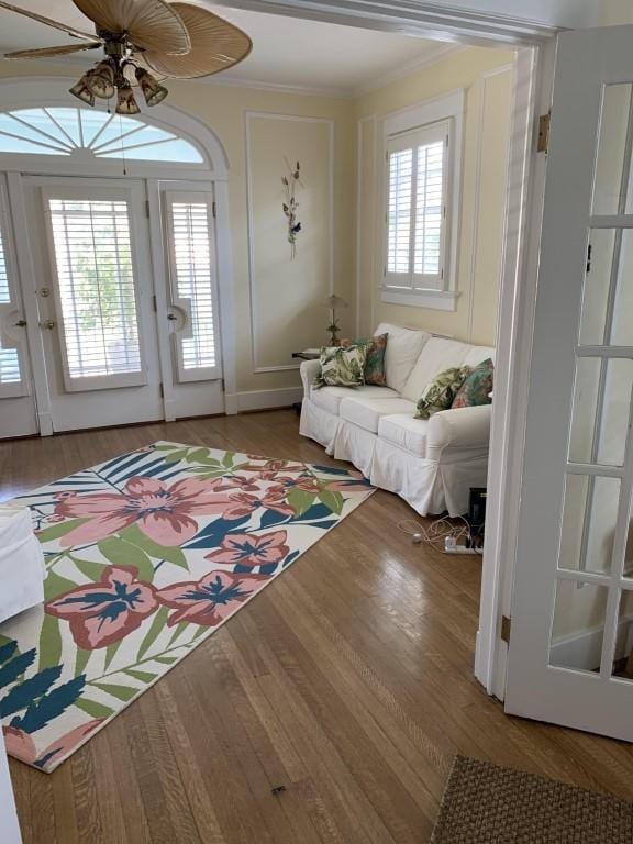 2527 Calhoun St, New Orleans, LA 70118 - living area with a ceiling fan, crown molding, and wood finished floors