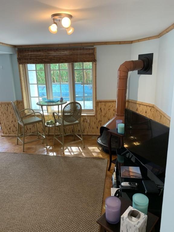 2527 Calhoun St, New Orleans, LA 70118 - dining area featuring a wainscoted wall and wood walls