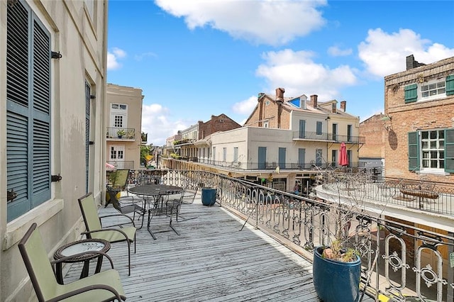 1140 Decatur St Unit 3, New Orleans, LA 70116 - wooden deck with a residential view and outdoor dining area