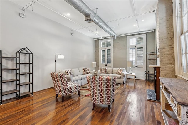 1140 Decatur St Unit 3, New Orleans, LA 70116 - living room featuring hardwood / wood-style floors and track lighting