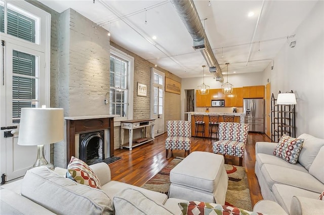 1140 Decatur St Unit 3, New Orleans, LA 70116 - living area with dark wood finished floors and recessed lighting