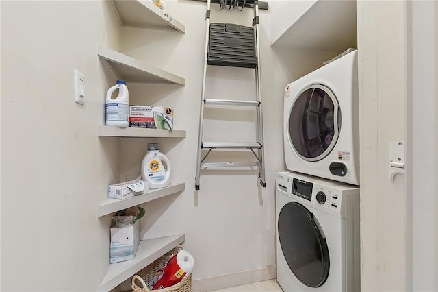 1140 Decatur St Unit 3, New Orleans, LA 70116 - laundry area featuring stacked washer / dryer and baseboards