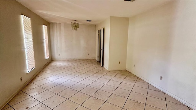 5761 Carlisle Ct, New Orleans, LA 70131 - unfurnished room featuring plenty of natural light and light tile patterned flooring