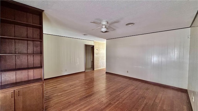 5761 Carlisle Ct, New Orleans, LA 70131 - spare room featuring a ceiling fan, wood finished floors, and a textured ceiling