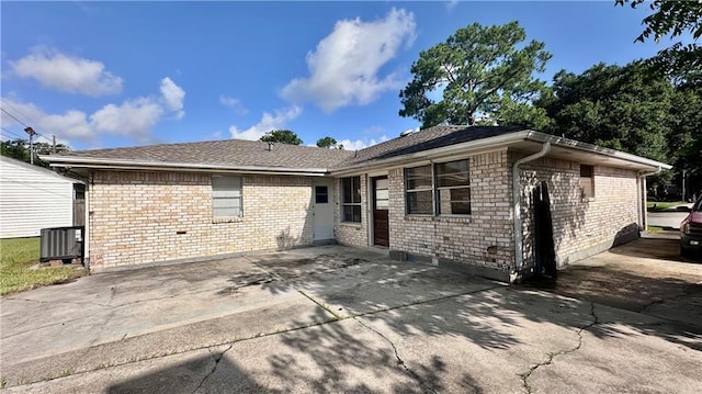5761 Carlisle Ct, New Orleans, LA 70131 - rear view of house with brick siding, a patio area, and concrete driveway