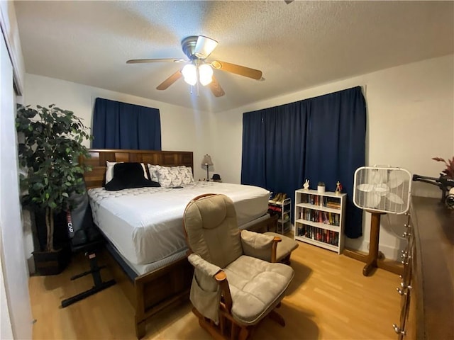 8007 Drum St, New Orleans, LA 70126 - bedroom featuring wood finished floors, ceiling fan, and a textured ceiling