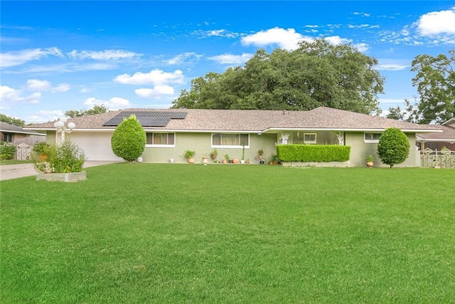 1435 Monterrey Blvd, Baton Rouge, LA 70815 - single story home featuring solar panels, a front lawn, a garage, and concrete driveway