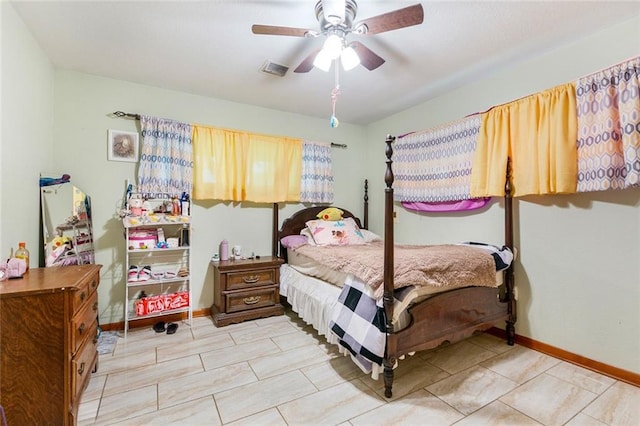 1435 Monterrey Blvd, Baton Rouge, LA 70815 - tiled bedroom featuring ceiling fan and baseboards
