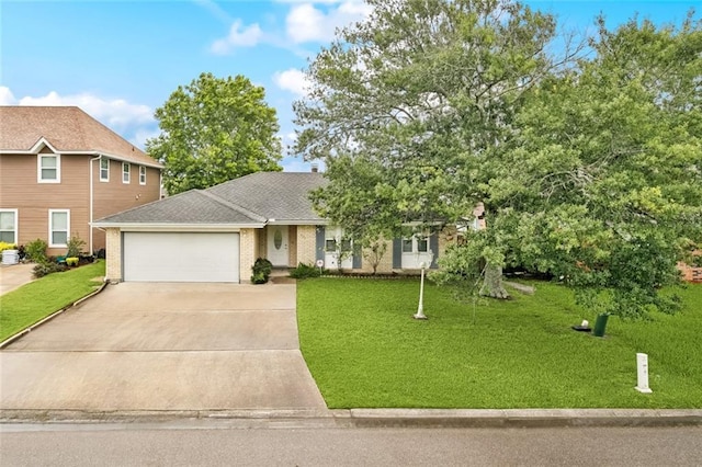 422 Eden Isles Blvd, Slidell, LA 70458 - view of front of home with an attached garage, concrete driveway, a front yard, and brick siding