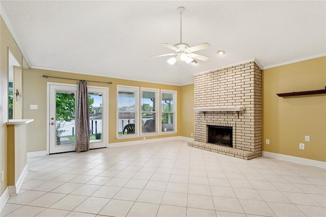 422 Eden Isles Blvd, Slidell, LA 70458 - unfurnished living room featuring a ceiling fan, crown molding, a brick fireplace, and light tile patterned floors