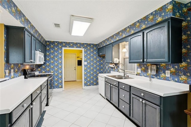 422 Eden Isles Blvd, Slidell, LA 70458 - kitchen with white appliances, light tile patterned flooring, light countertops, crown molding, and wallpapered walls