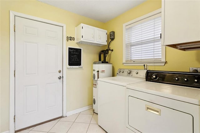 422 Eden Isles Blvd, Slidell, LA 70458 - washroom featuring water heater, cabinet space, washer and dryer, and light tile patterned floors