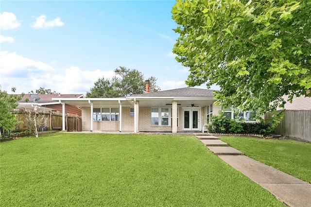 422 Eden Isles Blvd, Slidell, LA 70458 - ranch-style home featuring french doors, a fenced backyard, brick siding, and a chimney