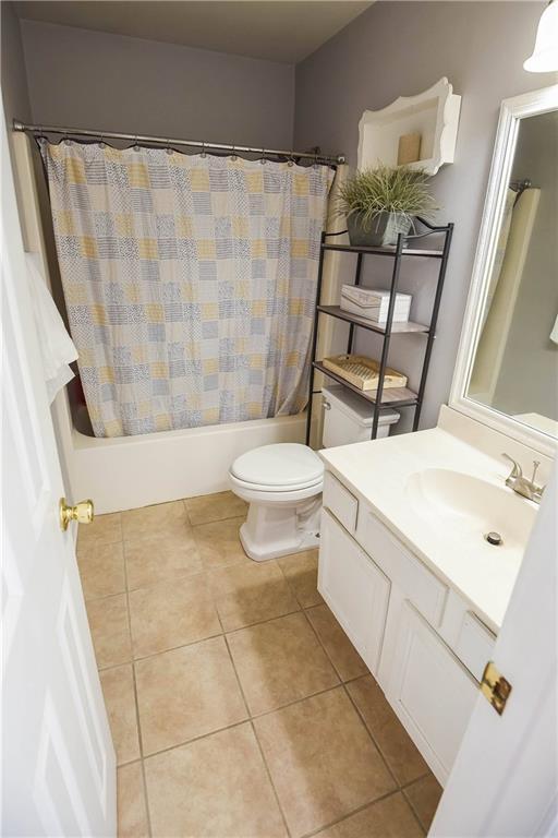 43126 Pecan Ridge Dr, Hammond, LA 70403 - bathroom featuring vanity, shower / tub combo, and tile patterned flooring