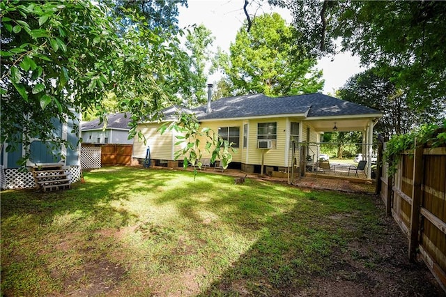 43126 Pecan Ridge Dr, Hammond, LA 70403 - back of property featuring a fenced backyard and a shingled roof