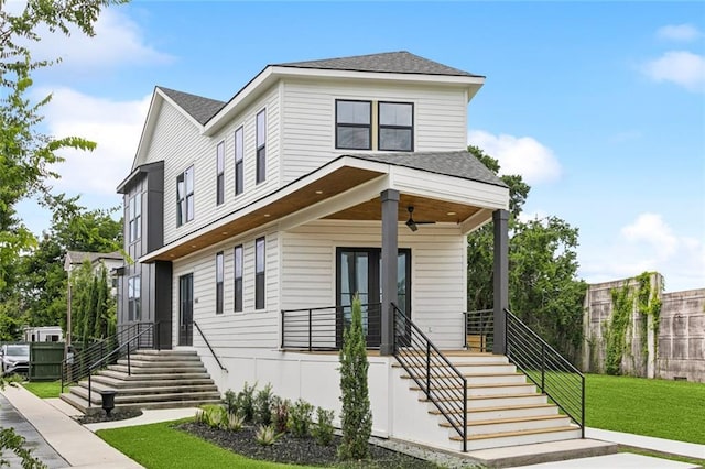 5651 W End Blvd, New Orleans, LA 70124 - view of front of home featuring stairs, ceiling fan, a front yard, and a shingled roof