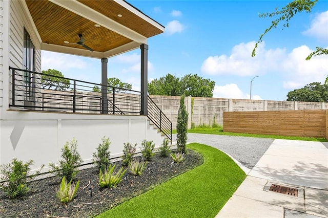 5651 W End Blvd, New Orleans, LA 70124 - view of yard featuring a ceiling fan and a patio area