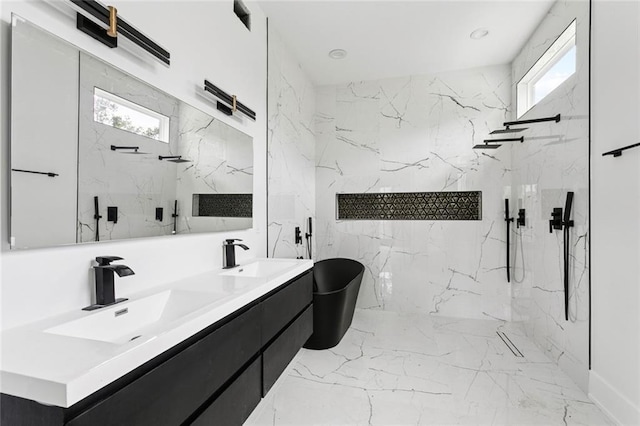 5651 W End Blvd, New Orleans, LA 70124 - bathroom featuring healthy amount of natural light, double vanity, a marble finish shower, and a freestanding bath